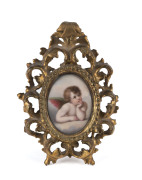 A miniature painting on porcelain of a cherub, in fine gilt wood frame, 19th century, 19 x 14cm overall