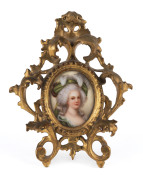 A miniature painting on porcelain of a lady with plumed hat, in fine gilt wood frame, 19th century, 17 x 13cm overall