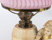 A pair of German figural bisque porcelain kerosene lamps with ruby glass shades, 19th century, 34cm high - 3