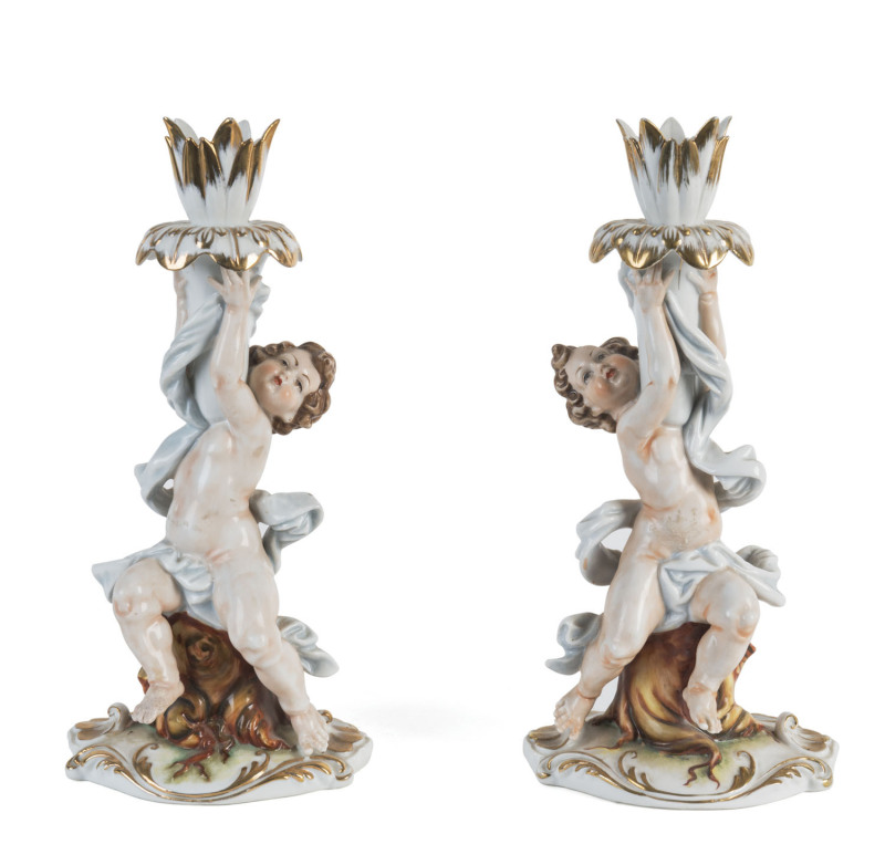 A pair of French porcelain candlesticks, 19th century, 26cm high