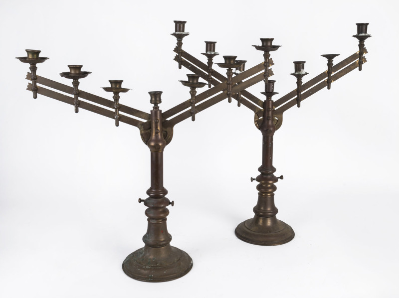 Two heavy brass telescopic church candelabra, late 19th century, the taller 64cm high