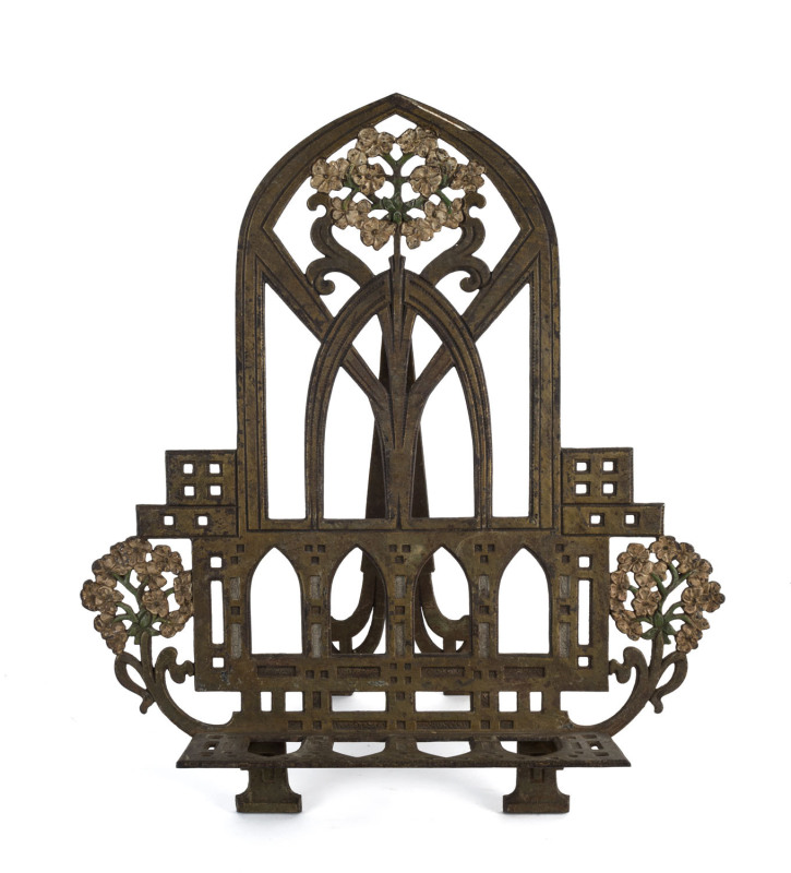 An America Arts and Crafts cold painted cast iron book stand, circa 1890, star stamp verso monogrammed "M", 47cm high