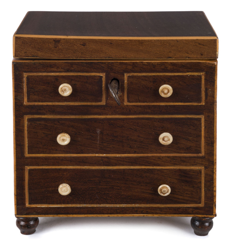 An English Georgian tea caddy in the form of a chest of drawers, mahogany and satinwood with whalebone handles, early 19th century, 13cm high, 12cm wide, 8cm deep