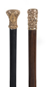 Two walking sticks with gold plated tops, and wooden shafts, 19th century, 89cm long