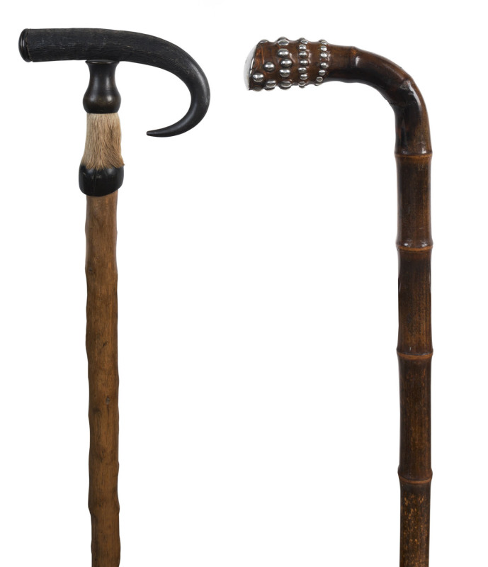 Two antique walking sticks, one with carved horn handle, the other with sterling cap and studs, 19th century, 90cm high