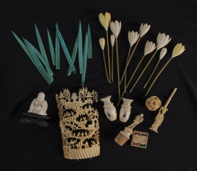 Collection of assorted ivory artefacts including flowers, Buddha statue, stopper, condiments, gaming tokens etc, 19th and early 20th century, the tallest 16cm high