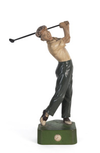 A fine wood-carving of a golfer, with hand-painted details and an ebony detachable club, Japanese/Hawaiian, circa 1930. Stamped to base for Saya Nyuny Wood Carver, USA. 19cm tall.