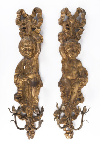 A pair of gilded and figural wall sconces, 19th century, 76cm high
