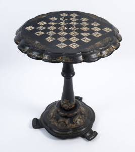 An English games table with tilt top, hand-painted papier-mâché, 19th century, 65cm high, 54cm across