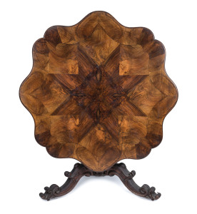 An Exhibition loo table, walnut, circa 1850 superbly crafted with book match veneered starburst shaped top with finely carved column and base, Exhibition label and owner's details attached and inscribed to the top and the base "No. 113, R.O. Blackwood, An