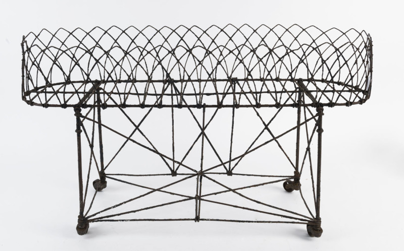 A Victorian wirework plant stand, 19th century, 43cm high, 76cm wide, 27cm deep