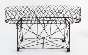 A Victorian wirework plant stand, 19th century, 43cm high, 76cm wide, 27cm deep