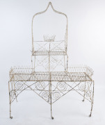 A Victorian wirework plant stand with white painted finish, 19th century, 158cm high, 120cm wide, 68cm deep