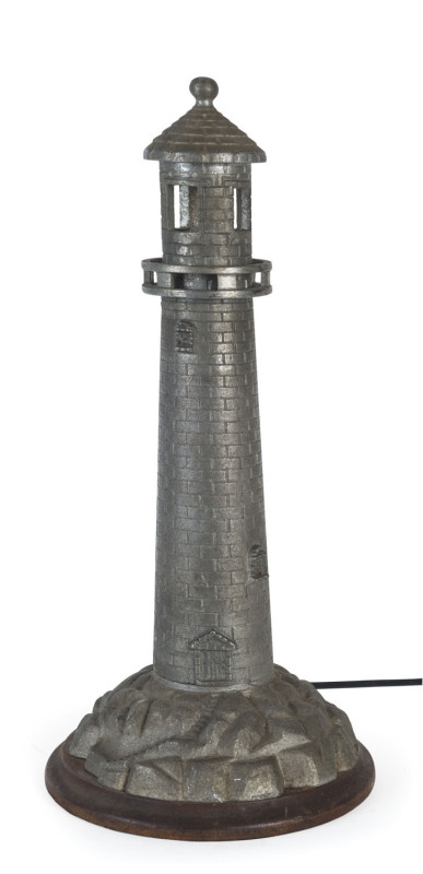 A lighthouse table lamp, cast metal on timber base, circa 1930, 45cm high