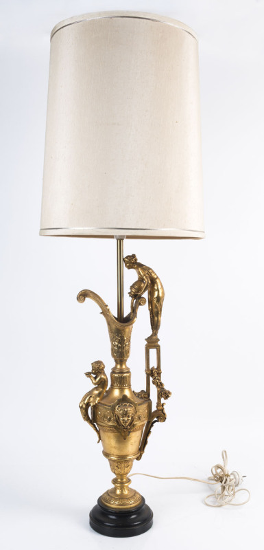 A gilt finished metal ewer based table lamp and shade, 106cm high overall