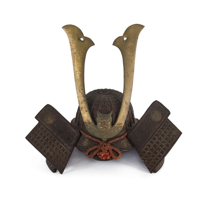 A Japanese ornamental Samurai helmet, cast metal and brass with silk cord, Meiji Period, 28cm high