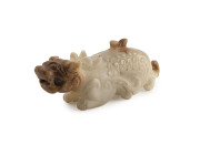 An antique Chinese carved jade leopard toggle, 10.5cm long