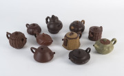 Ten Chinese Yixing clay teapots, 20th century, some with certificates, the tallest 12cm high