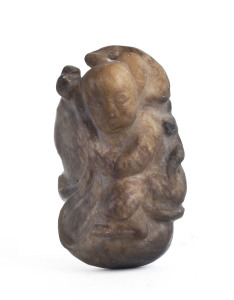 A Chinese carved jade figural toggle, 19th/20th century, 6cm high