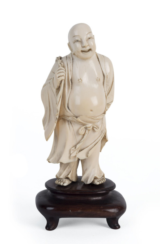 A Chinese carved ivory Buddha on wooden stand, Qing Dynasty, 19th century, 16.5cm overall