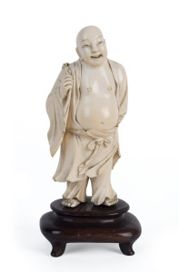 A Chinese carved ivory Buddha on wooden stand, Qing Dynasty, 19th century, 16.5cm overall