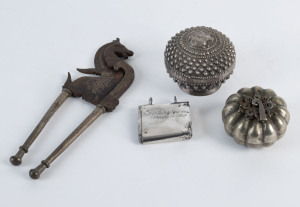 Laotian silver boxes, Malay silver flint box and an Indonesian betel nut cutter, 19th century, the cutters 21cm high