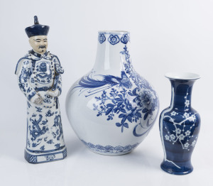 Chinese ceramic statue of a Mandarin and two blue and white porcelain vases, 20th century, the statue 55cm high