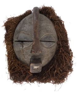 West African tribal mask, carved wood and fibre, early 20th century, 45cm high