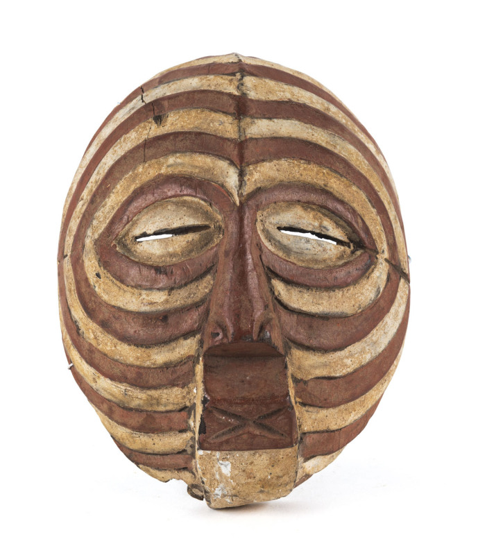 A tribal mask, carved and painted wood, West African, early 20th century, 24cm high