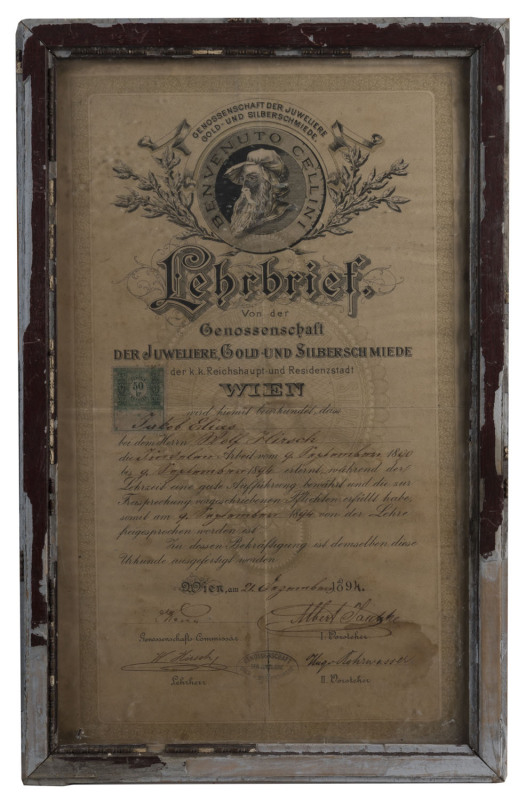 [JUDAICA] December 1894 Certificate of Apprenticeship of the Guild of Jewellers, Gold- and Silversmiths of Vienna, issued to Jakob Elias, whose supervising Master was Wolf Hirsch. The lithographed certificate features a cartouche portrait of Benvenuto Cel