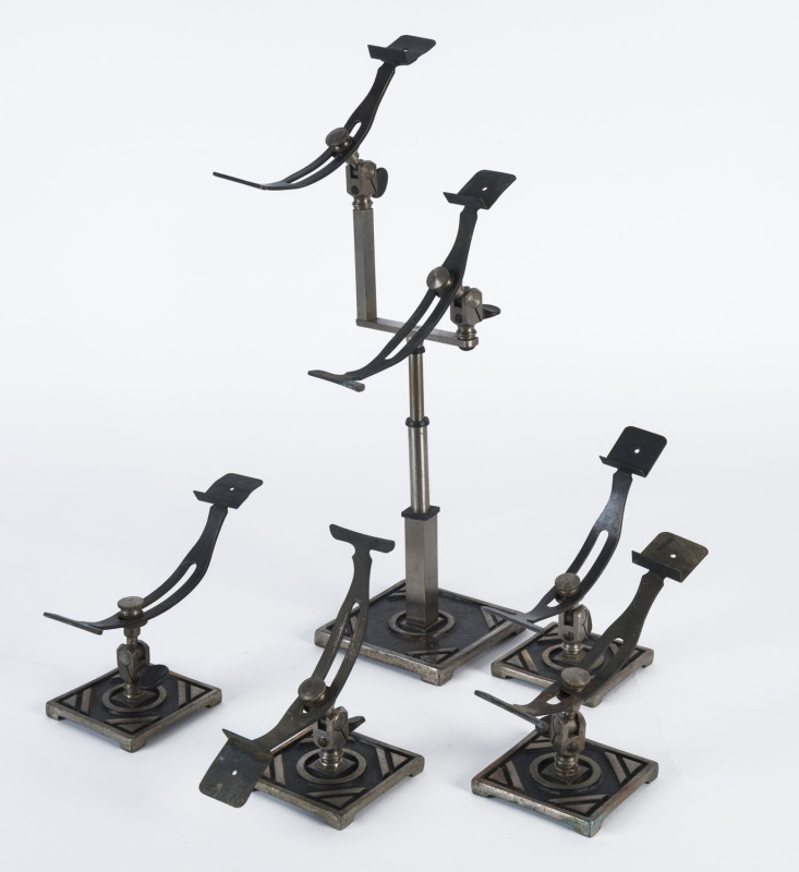 Five American Art Deco adjustable shoe shop display racks, circa 1930s, the tallest 42cm high