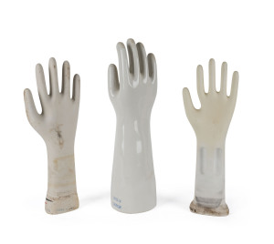 Three porcelain rubber glove moulds, 20th century, the tallest 42cm high