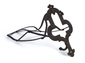 An English wall mount saddle rack, cast iron, 19th century, stamped "K & Co.", 53cm long