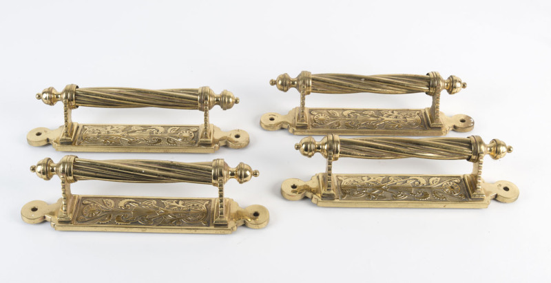 A set of four English Aesthetic Movement brass door handles, 19th century, 27cm high