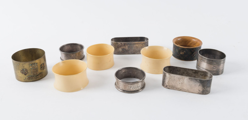 Group of ten assorted napkin rings, sterling silver, brass, mauchline ware, silver plate and bakelite, 19th and 20th century,