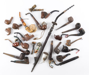 Assorted pipes, carved wood, Meerscham and ceramic, 19th and 20th century, the tallest 58cm high