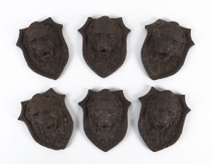 Set of six painted cast iron lion mask architectural fixtures, 13cm high