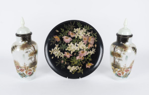 A pair of Victorian hand-painted opaque glass lidded vases together with a hand-painted pottery plaque, 19th century, the vases 38cm high