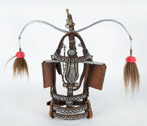 A decorative horse halter with bell and tassels, possibly for a street parade, 20th century, 58cm high