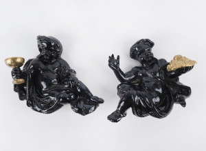 Two cast iron cherub sconces or wall features, later paint, 19th century, 20cm high