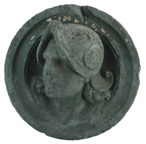 An architectural circular portrait plaque with green painted finish, 19th century, 37cm diameter