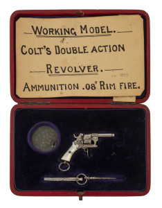 COLT double action miniature fob revolver in original plush fitted box, circa 1895, rare. the revolver 5.5cm long, the box 13cm across