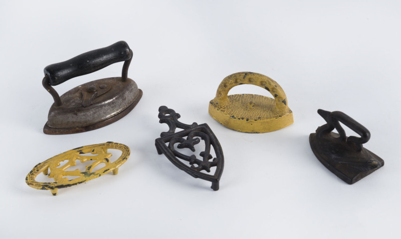 Three antique collar irons, two with original trivets, 19th century, the largest 9cm long