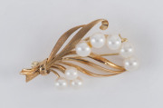 A 14ct gold and pearl brooch, stamped "14K" with pictorial maker's mark, 5cm across, 8.5 grams total