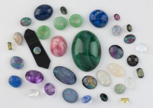 Collection of assorted cut and polished loose semi-precious stones including opal, lapaz lazuli, malachite, tourmaline and jade