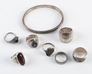 Seven assorted silver rings and a bangle, 20th century, 