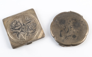Two Continental silver powder compacts with niello floral decoration, early 20th century, 8cm and 9cm across