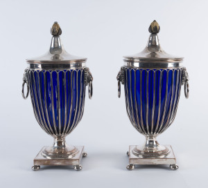 A pair of Sheffield plate lidded urns with Bristol blue glass liners and carved ivory pineapple finials, circa 1800, 33cm high