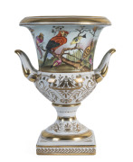 A porcelain urn decorated with bird motif and gilded highlights, 20th century, 36cm high