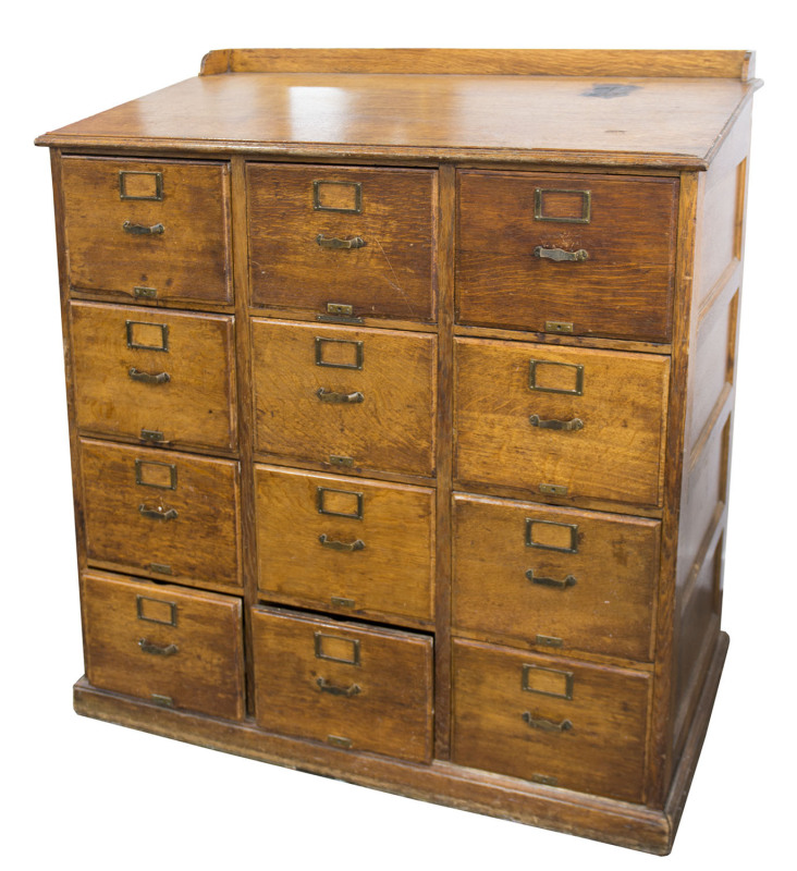 "Library Bureau" American oak 12 drawer file cabinet with sloping top, late 19th century, 139cm high, 124cm wide, 72cm deep